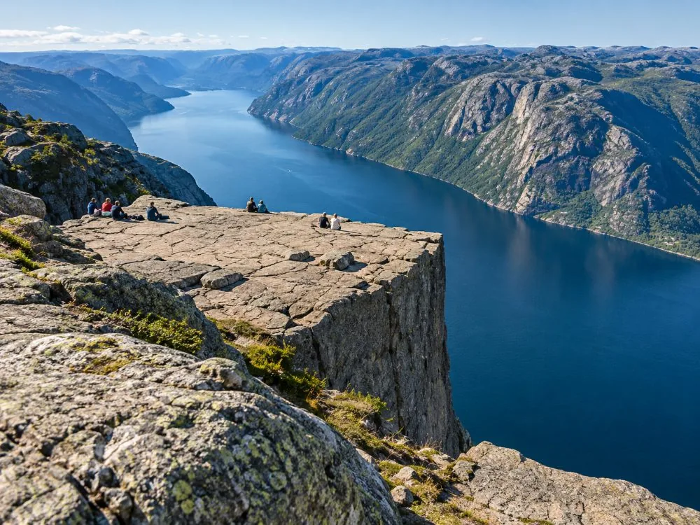 The unfenced granite plateau of Preikestolen seen from above the Lysefjord